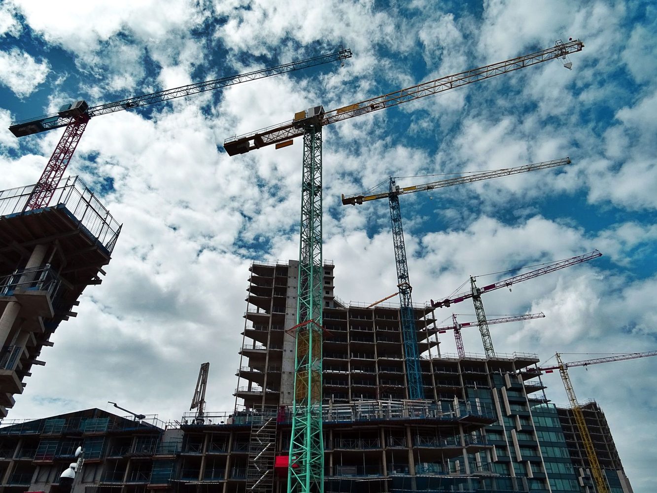 High-rise construction site with tower cranes